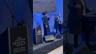 Sruli Altman on Stage at The Bar Mitzvah of Naftali Moshe Schnitzler’s Son